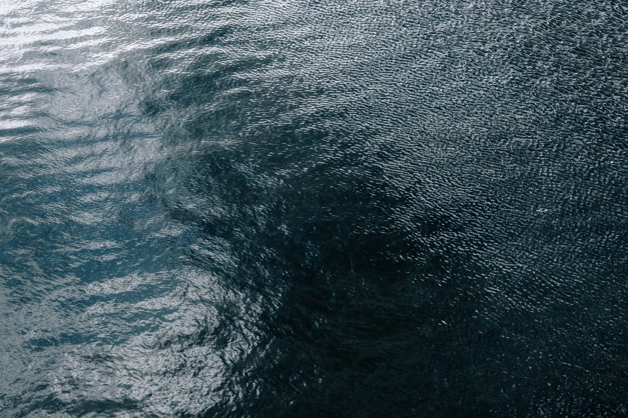Gentle movement across deep teal water